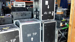 Stacked equipment cases prepared for white glove event delivery and exhibit setup.