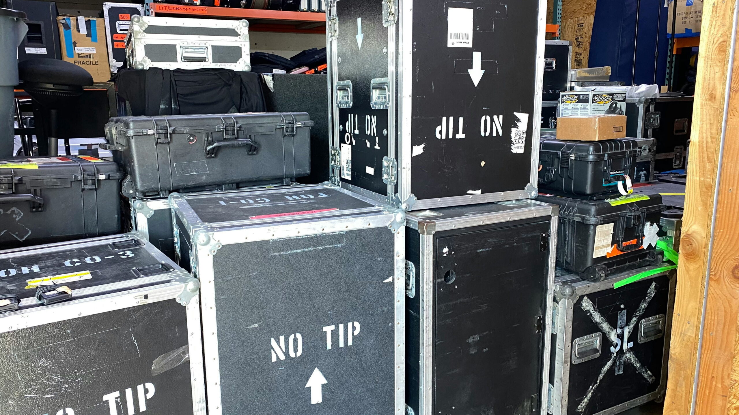 Stacked equipment cases prepared for white glove event delivery and exhibit setup.