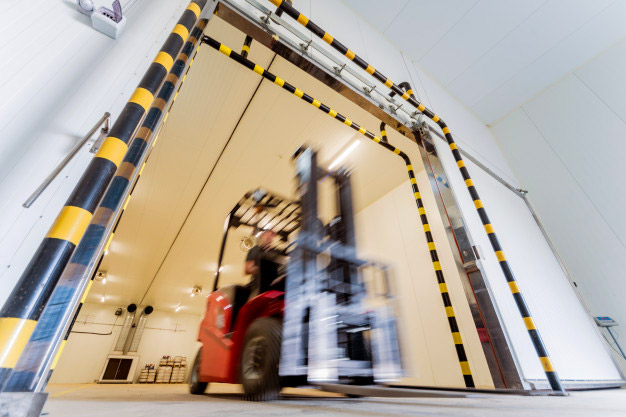 forklift driving through doorway