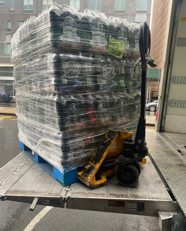 pallete of water being unloaded