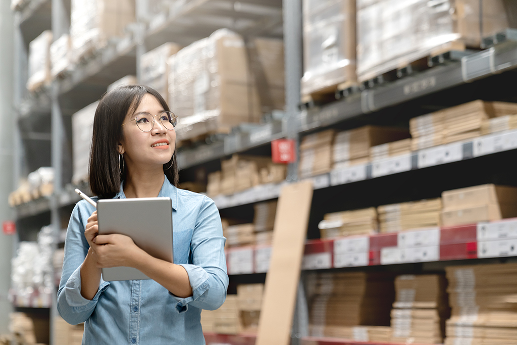 woman with ipad in warehouse