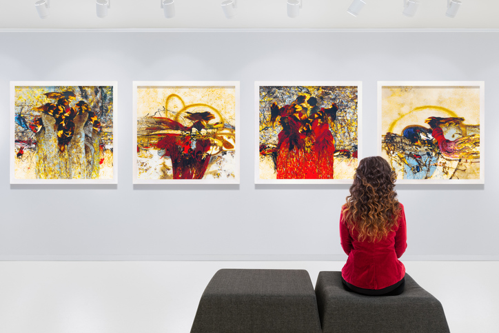 woman observing art gallery