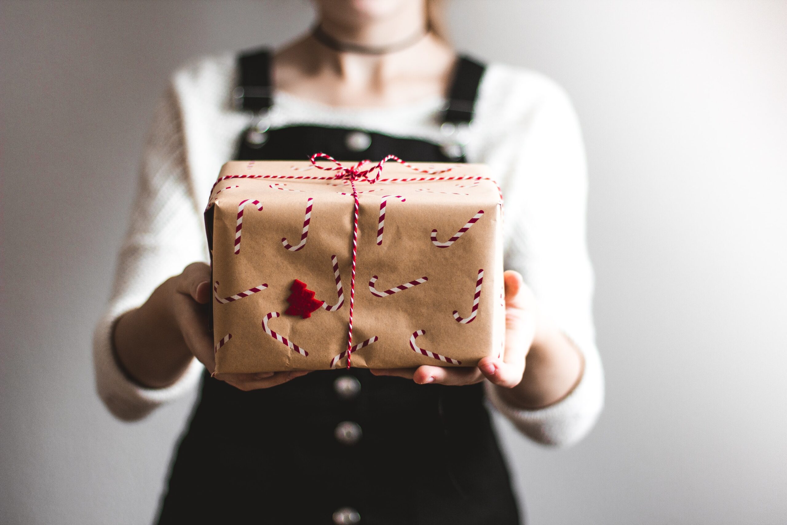 woman giving a holiday gift