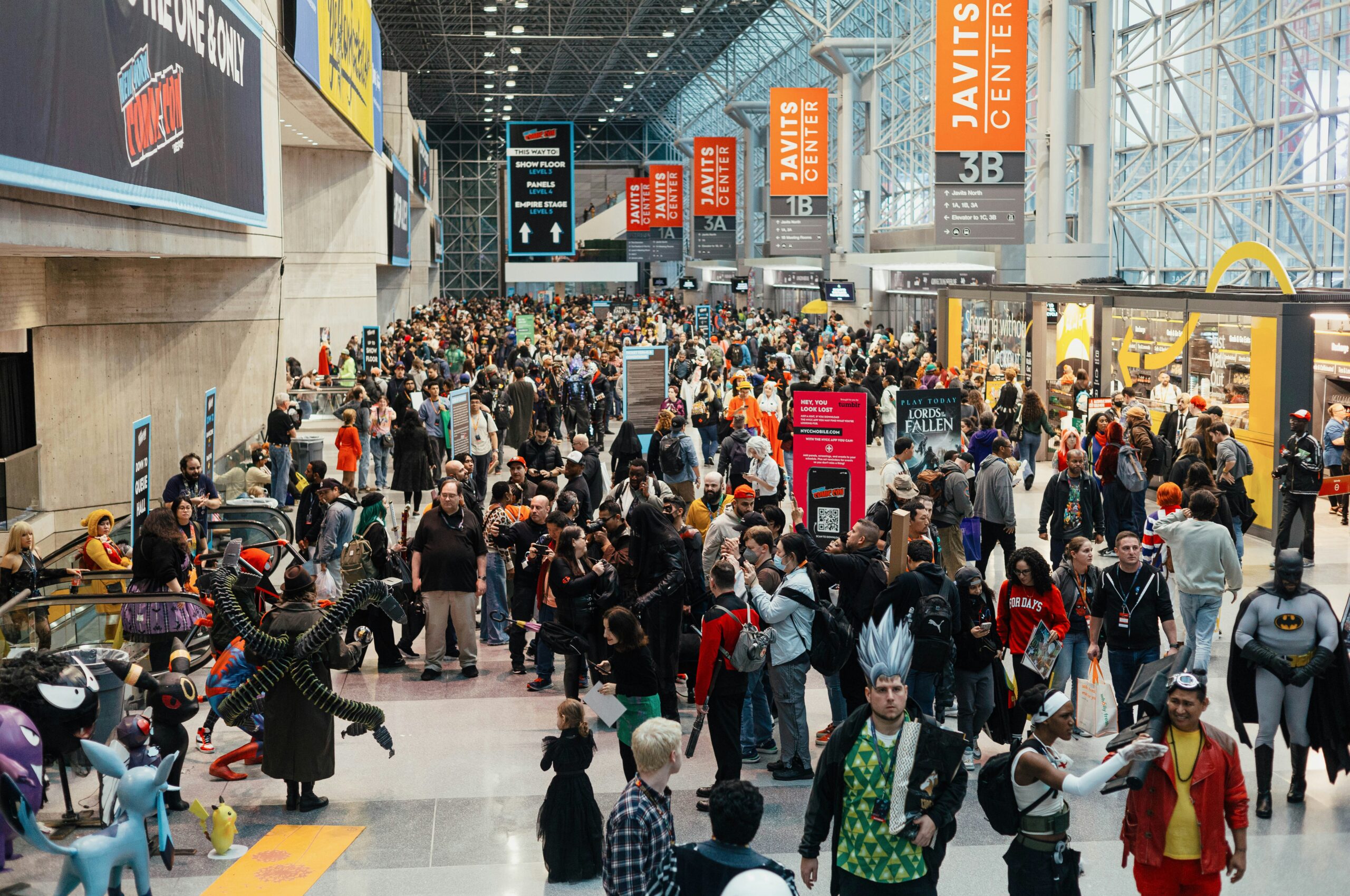 Convention attendees congregating in a concourse at the Javits Center in NY.