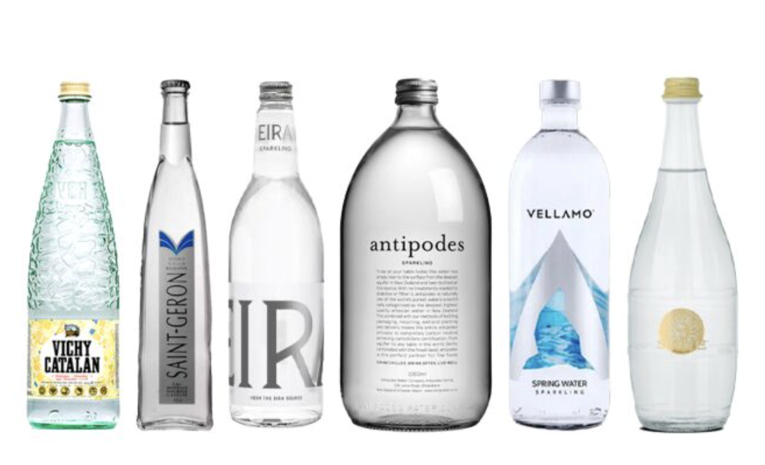 Six bottles of assorted sparking water brands.