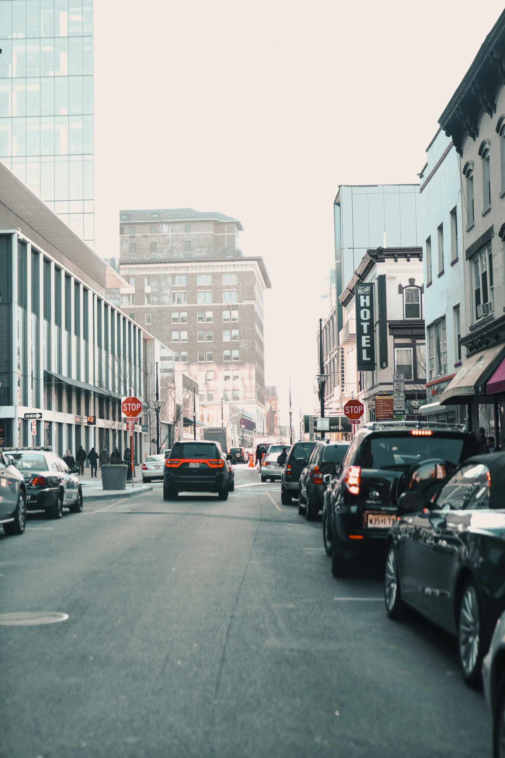 Street view in downtown Newark, New Jersey, with traffic, storefronts, and local buildings, reflecting the fast-moving business environment that drives regional logistics needs.