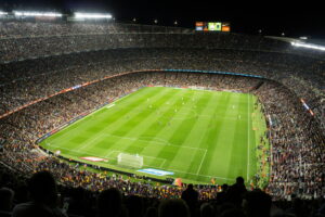 Crowded soccer stadium during a nighttime match, representing major event logistics and delivery planning for high-traffic venues.