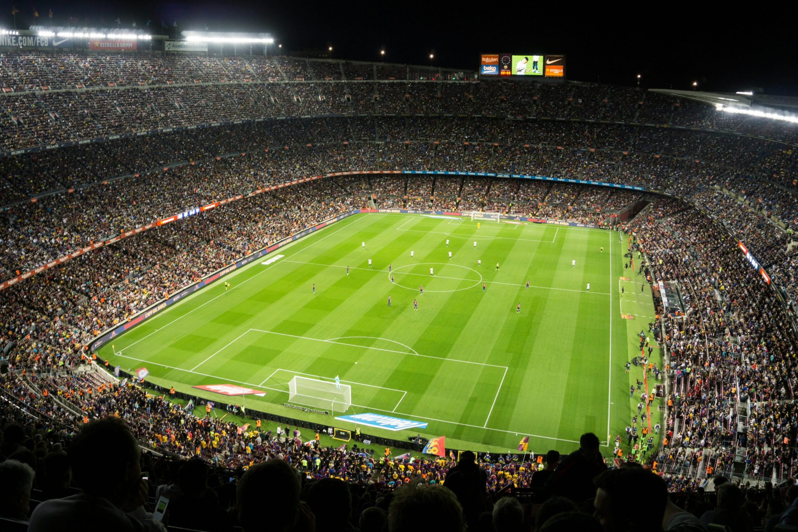 Crowded soccer stadium during a nighttime match, representing major event logistics and delivery planning for high-traffic venues.